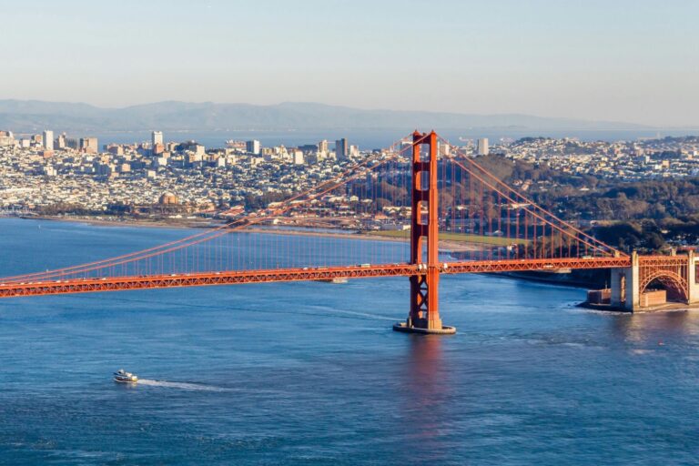 Golden Gate Bridge in San Francisco with a clear blue sky, taken from a scenic viewpoint. Iconic landmark and top travel destination in California.