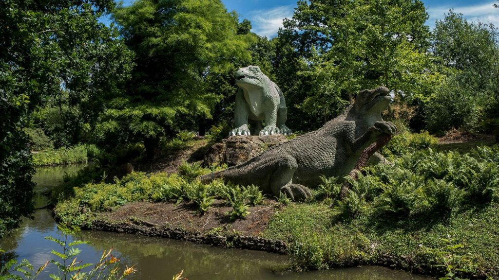 Crystal Palace Dinosaur Statues – an offbeat thing to do in London for curious travellers, featuring historic Victorian sculptures in a lush park.