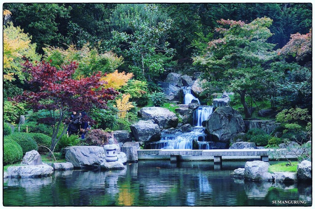 Kyoto Garden waterfall in Holland Park – an offbeat thing to do in London for curious travellers, featuring Japanese landscaping and tranquil koi ponds.