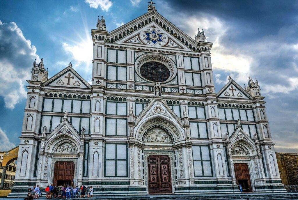 Santa Croce Basilica front view with tourists outside – Florence travel guide highlight
