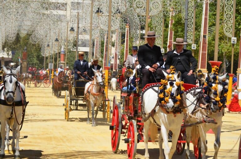 Best Things To Do In Jerez - Horse-drawn carriages and riders in traditional Andalusian dress at the Feria del Caballo in Jerez, Spain