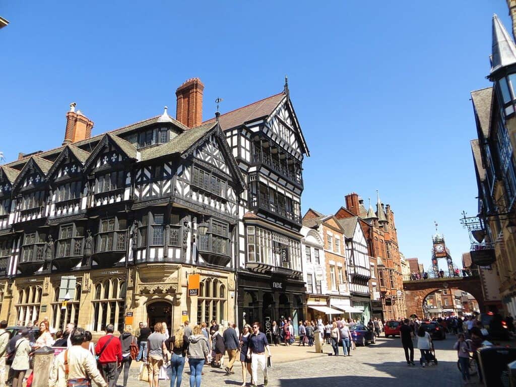 Timbered black-and-white buildings on Eastgate Street in Chester, England, with the Eastgate Clock