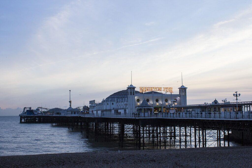 Brighton Palace Pier at sunset on the seafront in Brighton, England