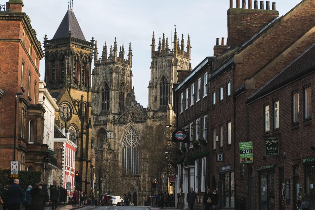 York Minster cathedral viewed from a historic street in York city centre, North Yorkshire, England